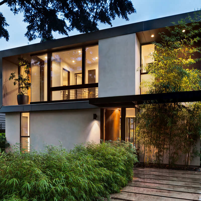 Exterior of modern style home with lots of windows